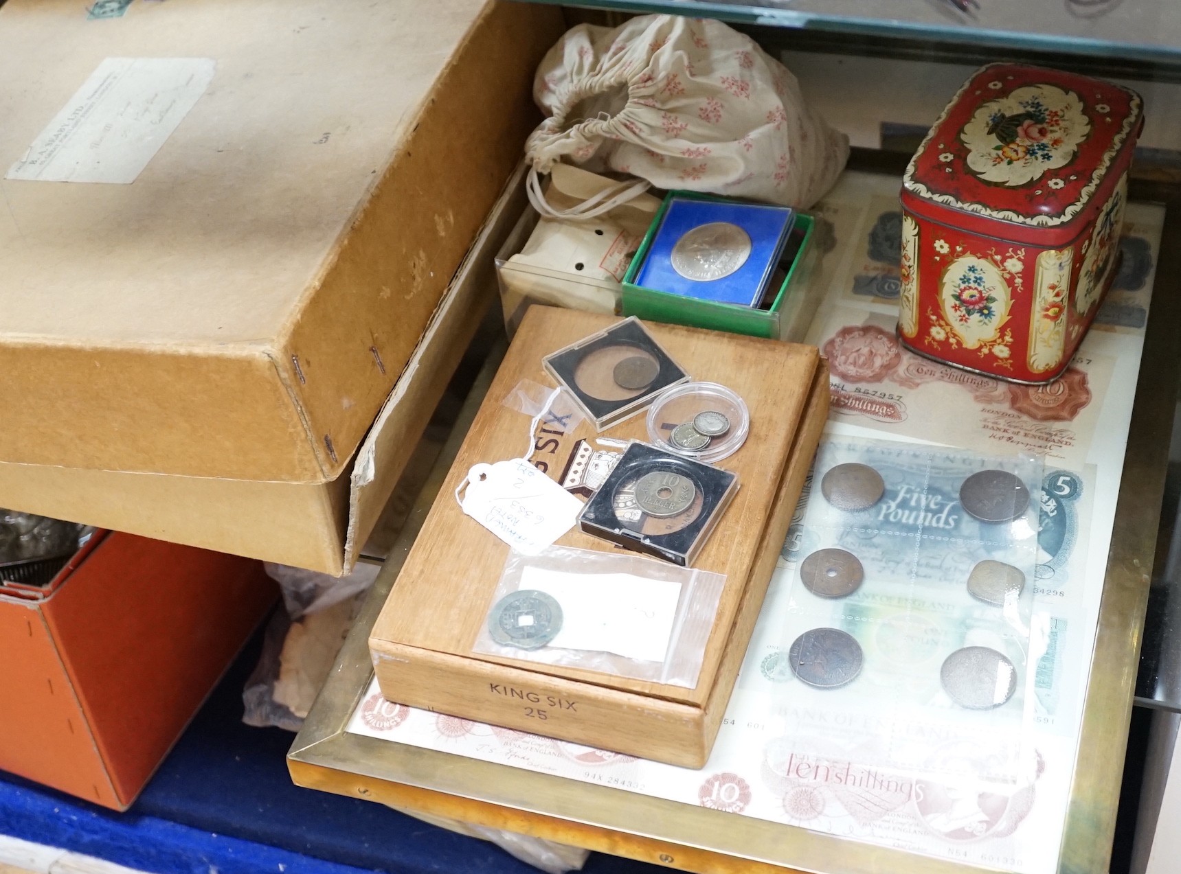 A quantity of mixed coins and bank notes